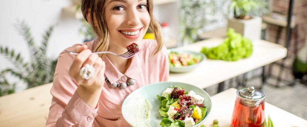 woman-eating-healthy-green-food